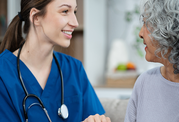 A doctor smiling at someone else
